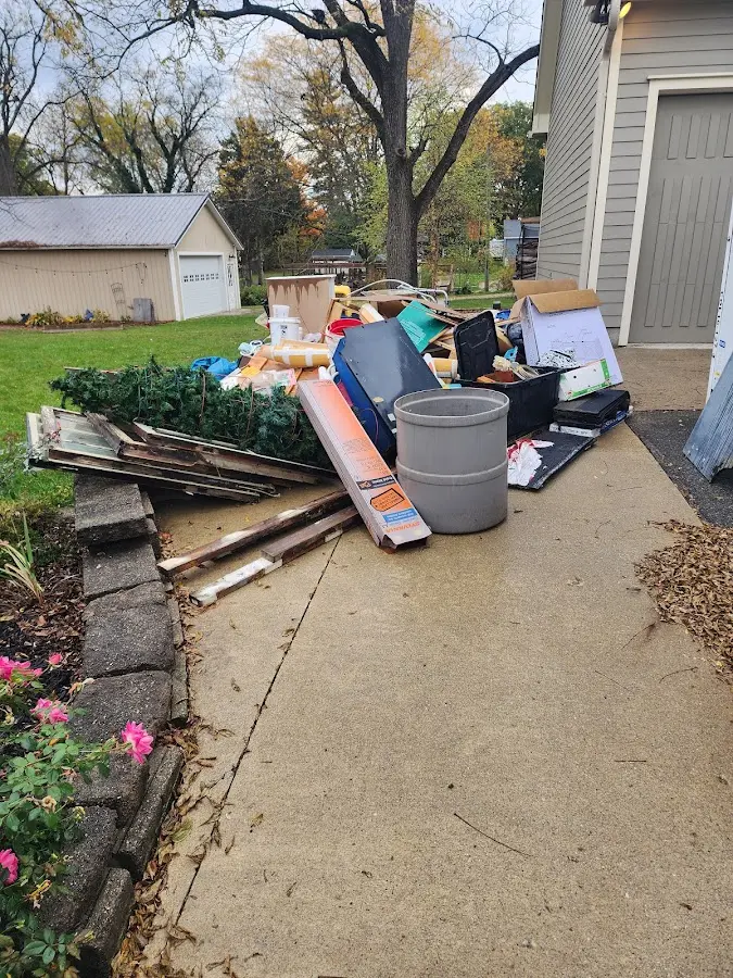 Dumpster being loaded with debris for 30 Yard Dumpster Rental in St. Gabriel
